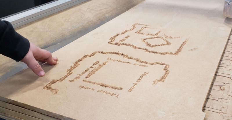 The Lettering did not fully cut because part of the material was lower than the rest. Securing the board with nails can help prevent this, and adjusting the cut depth can help.