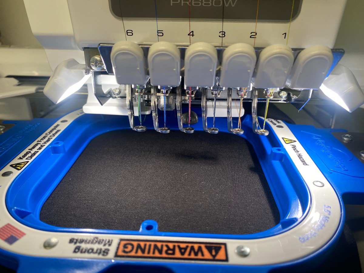 T-shirt loaded in embroidery hoop