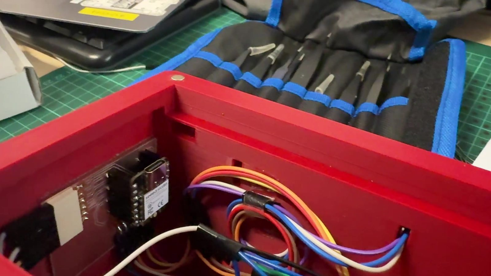 Internal packaging of display, controller, wires, buttons, and LEDs.