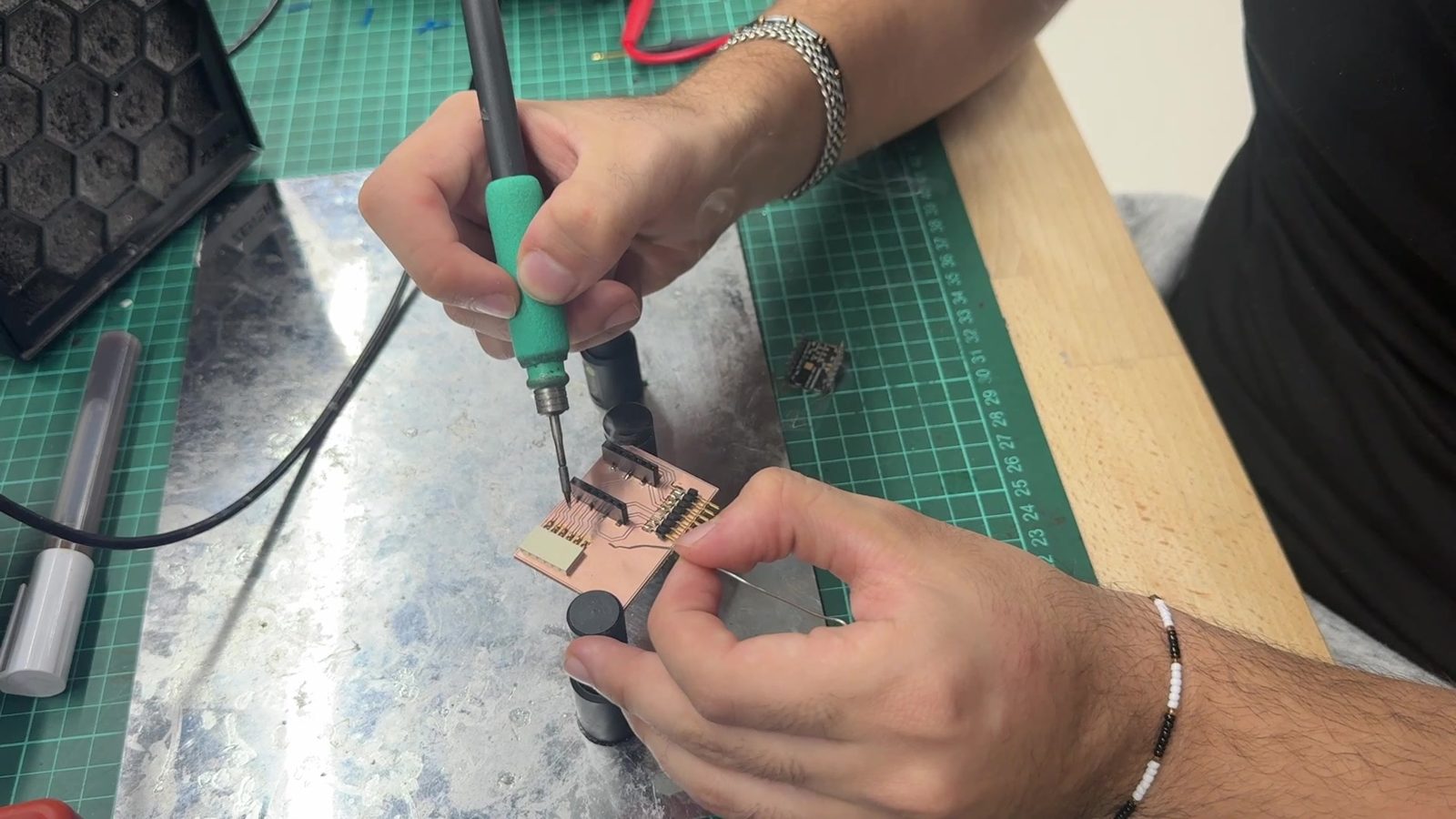 Hands-on soldering and electronics assembly during the project.